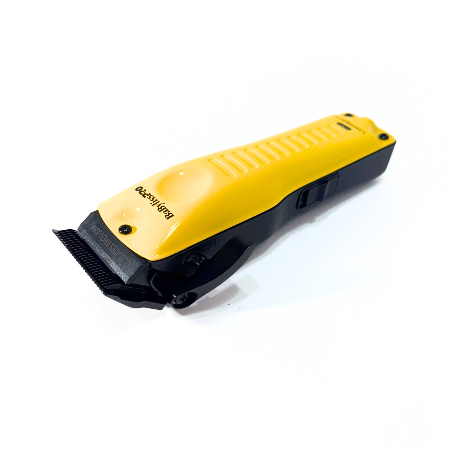 BaBylissPRO Yellow LO-PROFX Cordless Clipper FX825YI lying on angle