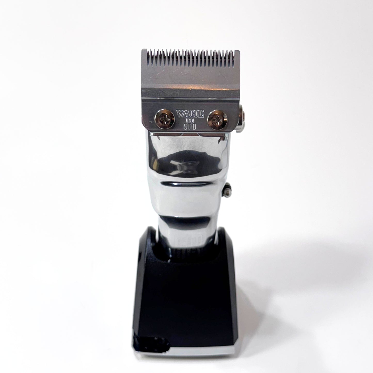 senior metal clipper on charging stand blade view