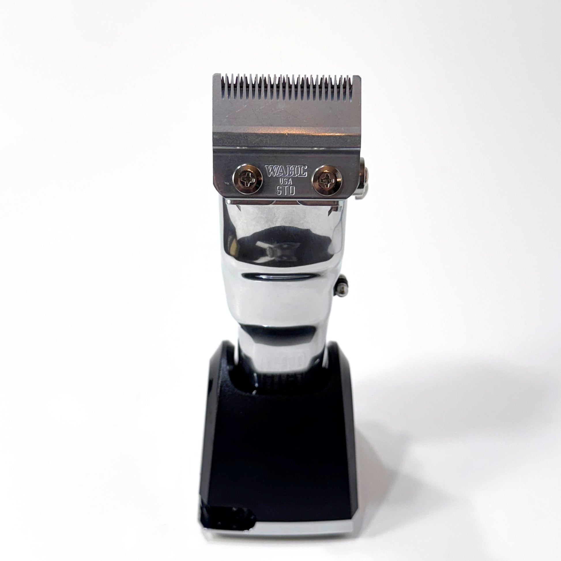 senior metal clipper on charging stand blade view